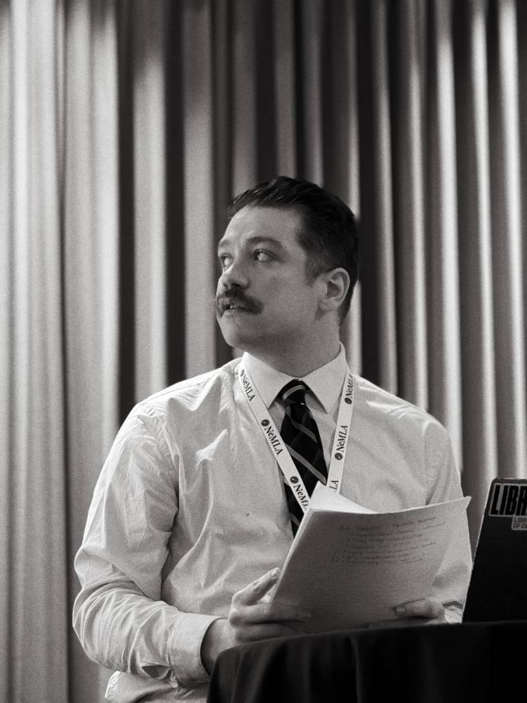 Anthony Gottlich delivering a conference paper at NEMLA 2026 (the Northeast Modern Language Association conference).